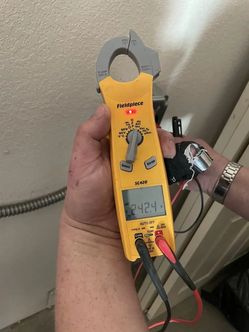 Voltage testing with clamp meter during Recessed Lighting Installation in Rockland